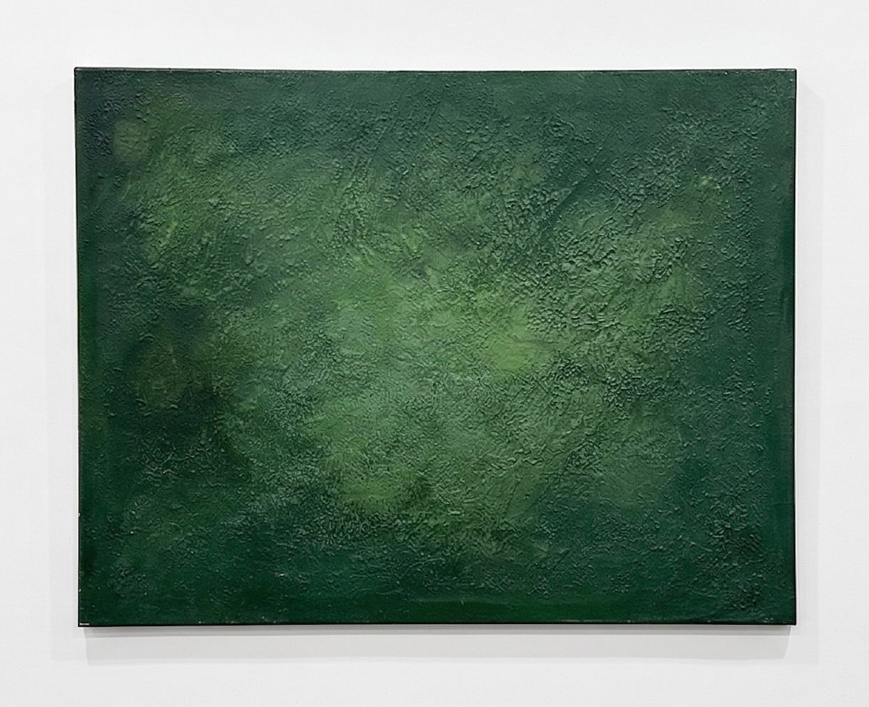 Abstract green textured painting at Palliser Advocats, Alaior